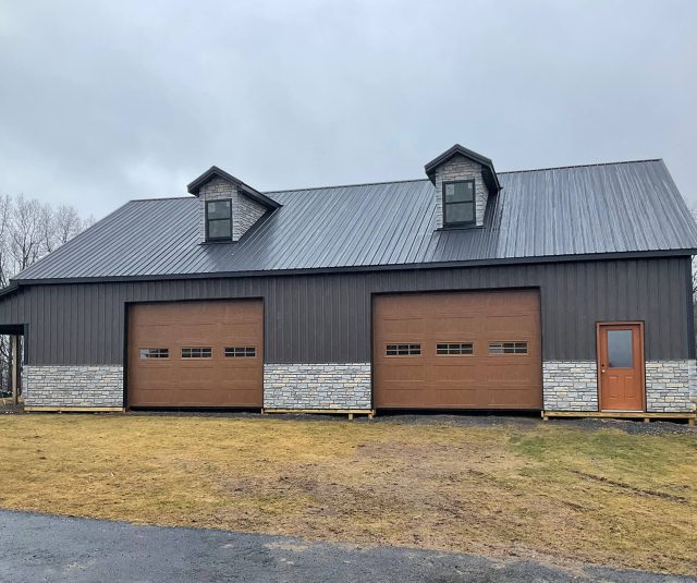 40x60x12-with-10x40-lean-to-Black-Roof-Burnished-Slate-Siding-Glacier-Bay-Wainscoting-Black-Trim-Fascia-and-Soffit